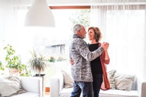 post-menopausal woman dancing with husband